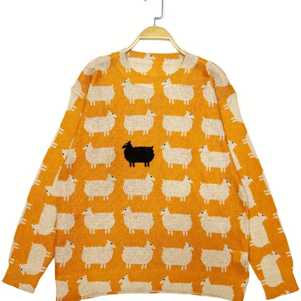 Black Sheep. Orange Sheep Pattern Crew Neck Sweater